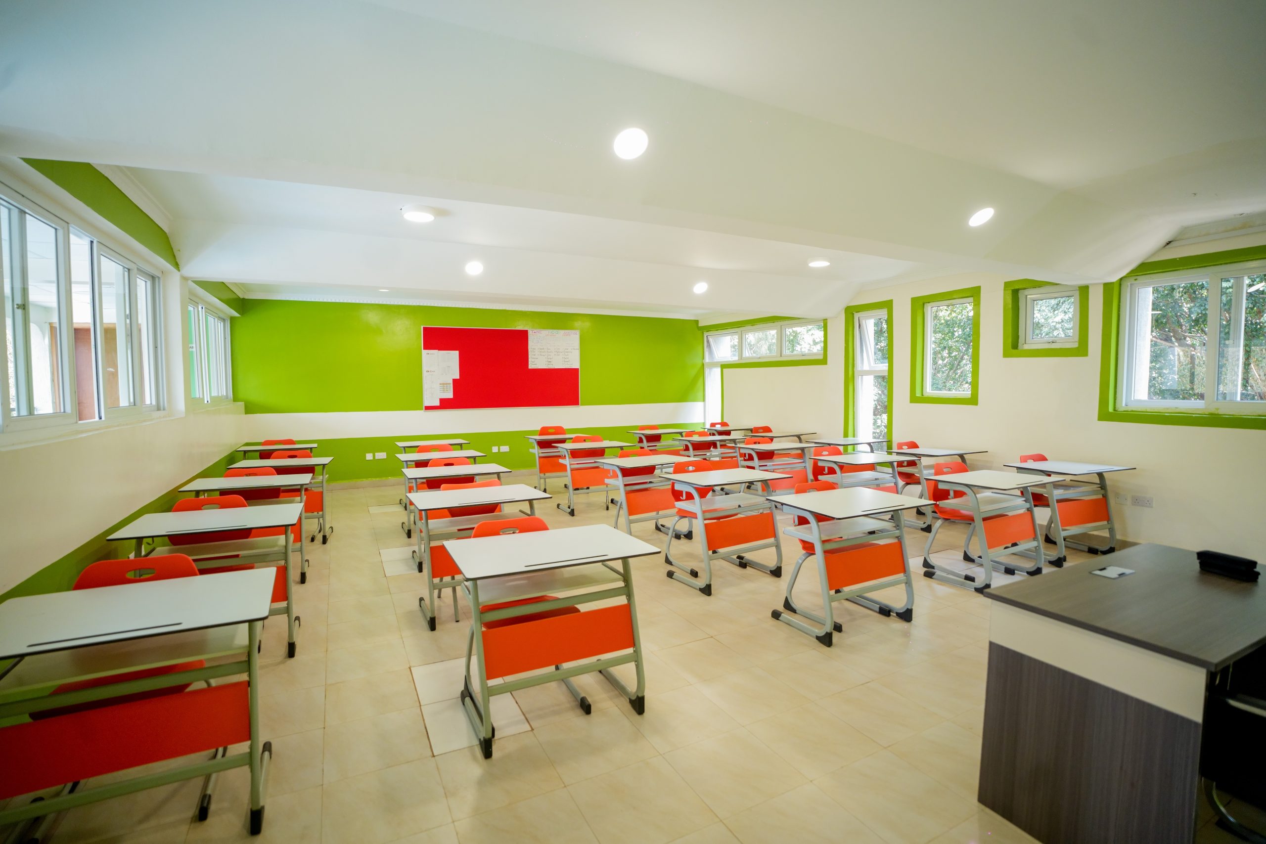 A modern SIS classroom with a smart screen