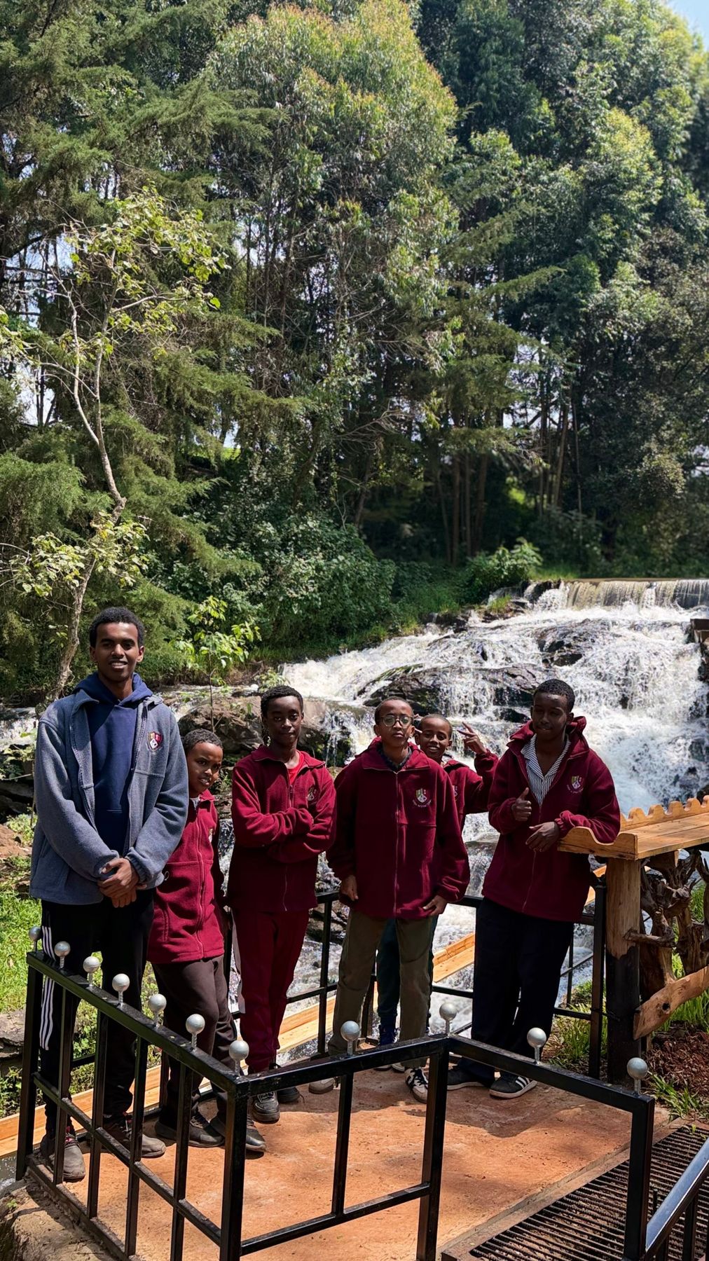 Boarders on a weekend trip to a waterfall